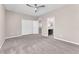 Bedroom with neutral walls, plush carpeting, and an ensuite bathroom through a doorway at 261 Via Morelli, Henderson, NV 89011