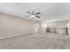 Bonus room with ceiling fan and staircase with wood banister at 261 Via Morelli, Henderson, NV 89011