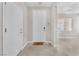 Bright foyer showcasing neutral walls and flooring, with a view of the adjacent living area at 261 Via Morelli, Henderson, NV 89011
