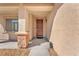 Close-up of a welcoming front door with decorative brick accents on the porch at 261 Via Morelli, Henderson, NV 89011