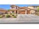 Attractive two-story home with a two-car garage and well-maintained landscaping at 261 Via Morelli, Henderson, NV 89011