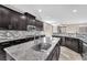 Gourmet kitchen featuring stainless steel appliances, granite countertops, and mosaic backsplash at 261 Via Morelli, Henderson, NV 89011