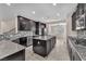 Spacious kitchen with stainless steel appliances, granite countertops, and a large center island at 261 Via Morelli, Henderson, NV 89011