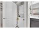 Laundry room with stacked washer and dryer next to the vanity at 261 Via Morelli, Henderson, NV 89011