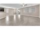 Spacious living room with tile flooring, neutral paint, and multiple windows for natural light at 261 Via Morelli, Henderson, NV 89011