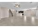 Expansive living room showcasing the kitchen and a staircase leading to the upper level at 261 Via Morelli, Henderson, NV 89011