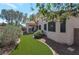 Well-maintained backyard with artificial grass, rock landscaping, and a covered patio for outdoor enjoyment at 2640 Torch Ave, North Las Vegas, NV 89081