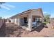An extended view of the house showing the backyard, the patio, and the fire pit at 2640 Torch Ave, North Las Vegas, NV 89081