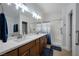 Bright bathroom with double vanity, modern fixtures, and separate shower at 2640 Torch Ave, North Las Vegas, NV 89081