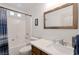 Bathroom featuring a toilet, vanity, mirror, and bathtub with shower at 2640 Torch Ave, North Las Vegas, NV 89081