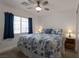 Bright bedroom with a ceiling fan, ample natural light, and a comfortable bed at 2640 Torch Ave, North Las Vegas, NV 89081