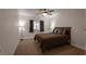 Comfortable bedroom with neutral tones, ceiling fan, and natural light at 2640 Torch Ave, North Las Vegas, NV 89081
