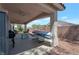 Spacious covered patio with ceiling fans, outdoor furniture, and storage, ideal for relaxation and entertainment at 2640 Torch Ave, North Las Vegas, NV 89081