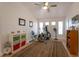 Bright exercise room with gym equipment, natural light, and comfortable carpeting at 2640 Torch Ave, North Las Vegas, NV 89081