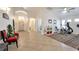 Inviting foyer with tile flooring, high ceilings, arched doorways, and space for exercise equipment at 2640 Torch Ave, North Las Vegas, NV 89081