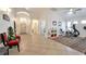 Bright entrance hall with tile floors, and a view of exercise equipment, provides an open, welcoming space at 2640 Torch Ave, North Las Vegas, NV 89081