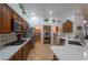 Modern kitchen featuring stainless steel appliances, quartz countertops, and a convenient pantry at 2640 Torch Ave, North Las Vegas, NV 89081