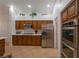 Well-equipped kitchen featuring stainless steel appliances and ample cabinet space at 2640 Torch Ave, North Las Vegas, NV 89081