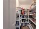 Walk-in pantry with ample shelving, providing lots of storage for food and kitchen essentials at 2640 Torch Ave, North Las Vegas, NV 89081