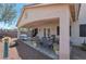 Covered patio with ceiling fans offers a relaxing outdoor space with lounge seating at 2640 Torch Ave, North Las Vegas, NV 89081