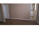 Bedroom with carpet flooring and view into attached bathroom at 2777 Beaconfalls Way, Las Vegas, NV 89142