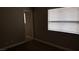 Bedroom showcasing neutral walls, carpet, and a window with blinds at 2777 Beaconfalls Way, Las Vegas, NV 89142