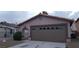 Single-Gathering home with a two-car garage with decorative windows and a terracotta tile roof at 2777 Beaconfalls Way, Las Vegas, NV 89142