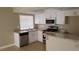 Bright kitchen featuring white cabinets, granite countertops, and stainless-steel appliances at 2777 Beaconfalls Way, Las Vegas, NV 89142