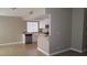Kitchen featuring white cabinets, granite countertops, stainless steel appliances, and a breakfast bar at 2777 Beaconfalls Way, Las Vegas, NV 89142