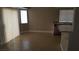 Open-concept living room features tile floors, neutral walls, and bright, natural light at 2777 Beaconfalls Way, Las Vegas, NV 89142