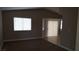 Cozy living room features plush carpeting and sliding glass doors at 2777 Beaconfalls Way, Las Vegas, NV 89142