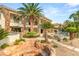 Beautiful backyard featuring a pool, mature palm trees, an outdoor seating and manicured plants at 2793 Red Arrow Dr, Las Vegas, NV 89135
