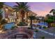 Beautiful backyard with a luxurious pool, rock waterfall, and lush landscaping at 2793 Red Arrow Dr, Las Vegas, NV 89135