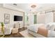 Inviting bedroom with a chandelier, and window seat with a view and ensuite bathroom at 2793 Red Arrow Dr, Las Vegas, NV 89135