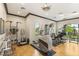 Well-equipped home gym featuring a variety of exercise machines and free weights, overlooking the yard at 2793 Red Arrow Dr, Las Vegas, NV 89135