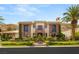 Stunning stone and stucco home with lush landscaping and a grand entrance at 2793 Red Arrow Dr, Las Vegas, NV 89135