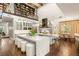 Gourmet kitchen with a center island, white marble countertops, custom cabinetry, and top-of-the-line appliances for culinary enthusiasts at 2793 Red Arrow Dr, Las Vegas, NV 89135