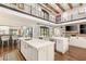 Open kitchen featuring a large center island, modern cabinetry, and stainless steel appliances for a seamless cooking experience at 2793 Red Arrow Dr, Las Vegas, NV 89135