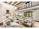 Open concept living area with soaring ceilings, clerestory windows, wooden beams, and seamless connection to the gourmet kitchen at 2793 Red Arrow Dr, Las Vegas, NV 89135