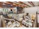 Spacious two-story living room overlooking a chef's kitchen and seating areas featuring abundant natural light at 2793 Red Arrow Dr, Las Vegas, NV 89135