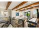 Open living room with wooden beams, light furniture, and an open floorplan that is perfect for entertaining at 2793 Red Arrow Dr, Las Vegas, NV 89135