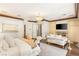 This elegant main bedroom features a decorative fireplace, seating area, and ensuite bathroom at 2793 Red Arrow Dr, Las Vegas, NV 89135