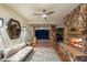 Inviting outdoor living space with a fireplace and comfortable seating area with scenic views at 2793 Red Arrow Dr, Las Vegas, NV 89135