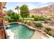 Stunning mountain views from the elevated perch showing the custom pool with volleyball net at 2793 Red Arrow Dr, Las Vegas, NV 89135