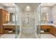 This spacious walk-in shower features dual shower heads, seating, and pebble flooring at 2793 Red Arrow Dr, Las Vegas, NV 89135