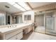 A spacious bathroom with a double sink vanity and large sliding mirror closet at 2857 San Lago Ct, Las Vegas, NV 89121