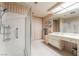 Spacious bathroom featuring a walk-in shower, vanity, and ample cabinet space at 2857 San Lago Ct, Las Vegas, NV 89121