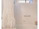 Bathroom featuring a bathtub and shower with white tile at 2857 San Lago Ct, Las Vegas, NV 89121