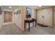 Inviting foyer with tiled flooring, stylish console table, and elegant decor at 2857 San Lago Ct, Las Vegas, NV 89121