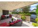 Cozy covered patio with comfortable seating and privacy wall at 2857 San Lago Ct, Las Vegas, NV 89121